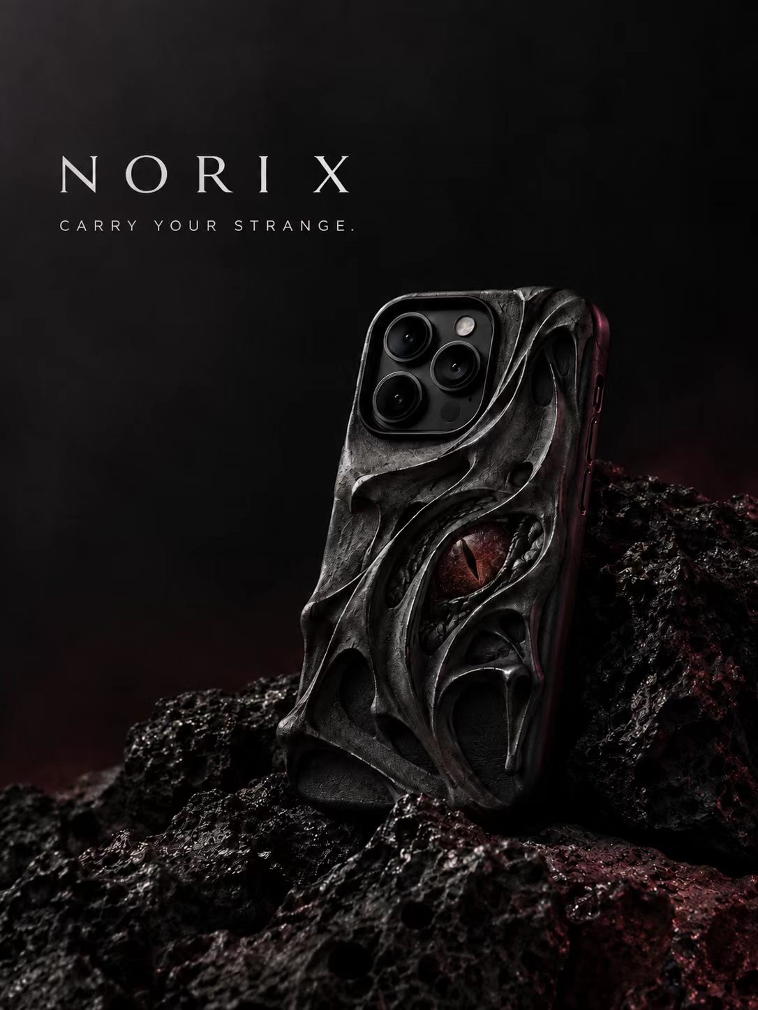 NORI X sculptural phone case with an eye motif on dark stone